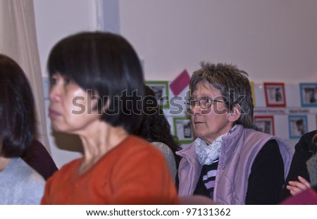 EXETER - MARCH 8 : Members of the audience at the International Women\'s Day event at the St Sidwell\'s Centre in Exeter,  Devon  on March 8, 2012 in Exeter Devon uk