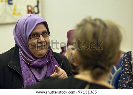 EXETER - MARCH 8 : Women in discussion at the International Women\'s Day event at the St Sidwell\'s Centre in Exeter,  Devon  on March 8, 2012 in Exeter Devon uk