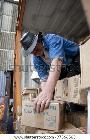 EXETER - MARCH 9: Volunteers from BookCycle stack boxes inside the container that is taking donated books to Ghana on March 9,  2012 in Exeter.