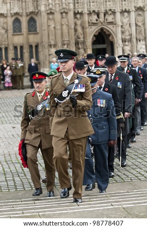 EXETER - NOVEMBER 13: Officers from the army, airforce and navy march from Exeter Cathedral during the rememberance Day service on Exeter Cathedral Green on November 13, 2011 in Exeter, UK