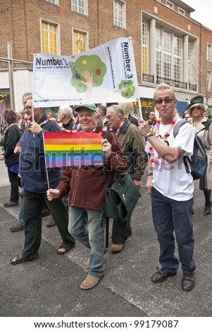 EXETER - MARCH 31: Festival goers from Number 3 LGBT Support Group at the Exeter Pride 2012 Parade in Exeter City centre on March 31, 2012 in Exeter, UK