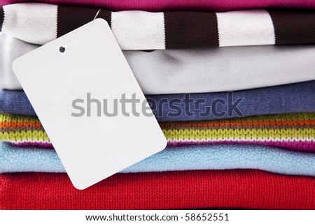 background of folded cloths with blank label