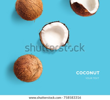 Creative layout made of coconut on blue background. Flat lay. Food concept. Macro  concept.