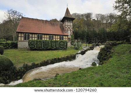 Old Church at Rickford with stream in flood. Blagdon, Somerset