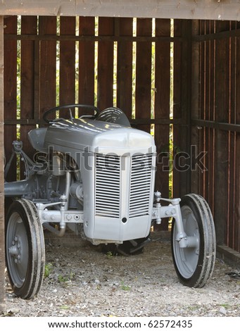 Restored Grey Vintage Farm Tractor in shed