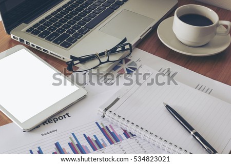 Business documents on desk.