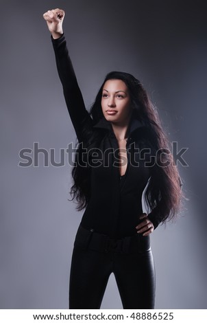 gorgeous long-haired super hero woman in black suit