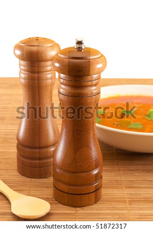 Pepper box and salt cellar with vegetable soup