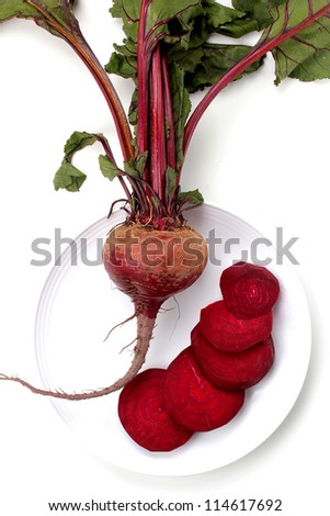 Natural red beets on a white background.