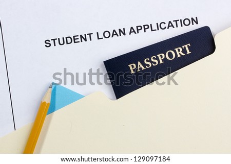 Directly above photograph of a student loan application and a passport.