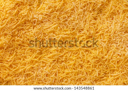 Grated cheese as background yellow. Nutrition. Food.