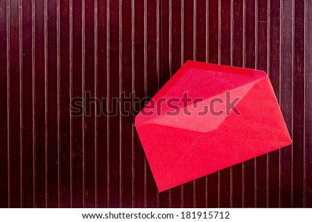 Background with sheet of paper and pen red envelope