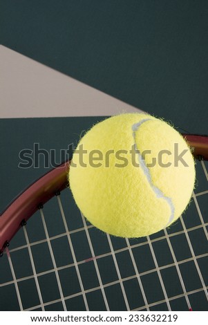 Racket and tennis balls with parchment. Sports equipment.