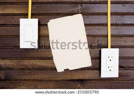 Wooden wall with adjustable sockets and switches.