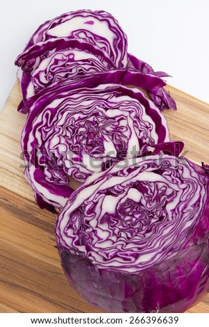 Sliced red cabbage is used for salads. On the kitchen blackboard.