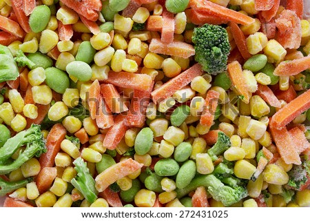 Frozen vegetables. Frozen vegetable mixture of carrots, corn and peas.