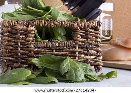 Spinach leaves on the kitchen table. Organic food.