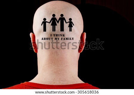 Text on the bald head I think about my family.