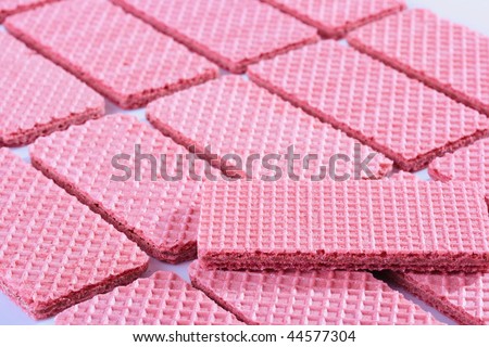 Pink sweet wafers are laid out by equal numbers.