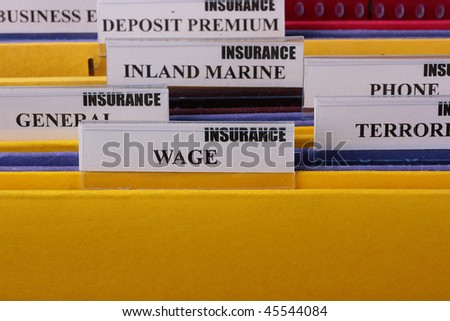 Folders with documents on insurance Wage in the insurance company.