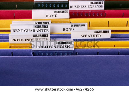 Folders for documents at office of the insurance company with Political Risk.