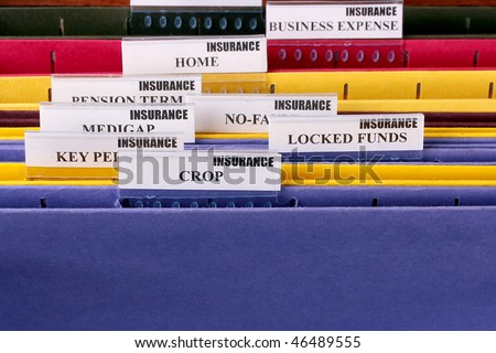 Folders for documents at office of the insurance company with Crop.