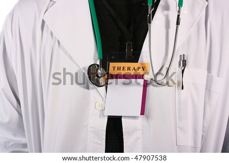 The doctor in a white dressing gown with a stethoscope and ID Card with an inscription Therapy.