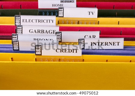 Folders in which are stored documents with bills and the information under credits.