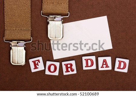By a holiday day of the father man's braces, business a card and inscription For Dad.