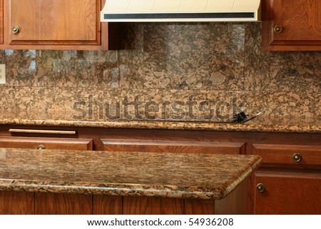 Granite covering for a working surface and an electric plate, a kitchen table.