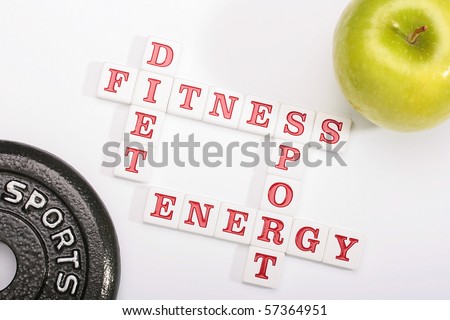 Creative on a theme of a healthy way of life. From ceramic letters the combination of words fitness, a diet, energy and sports is collected.