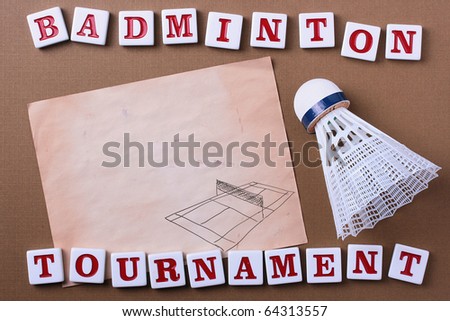 A white synthetic badminton shuttlecock next to a piece of paper. Add your text to the paper.