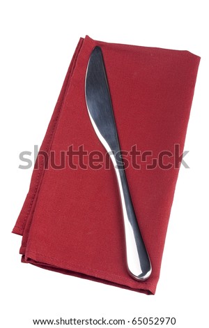 Table knife on a red cloth, tissue.