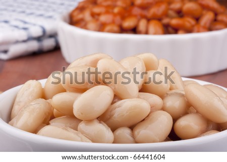 White canned beans in a white ceramic dish.