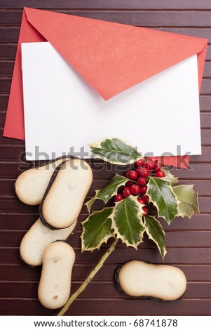 Letter to Santa Claus with cookies on a wooden background.