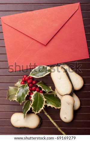 Letter to Santa Claus with cookies on a wooden background.
