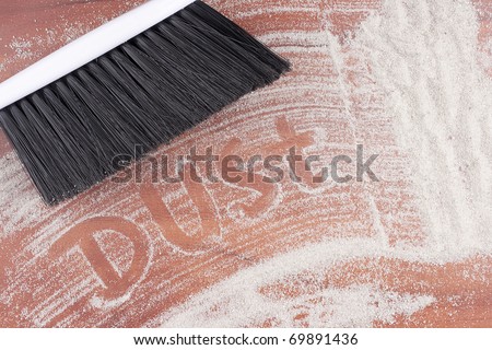 House cleaning, on a floor small sand simulating dust is scattered.
