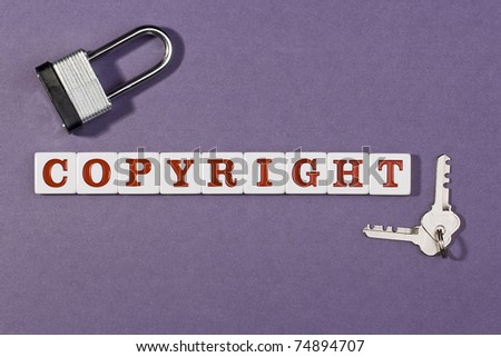 Word copyright on a purple background next to a lock and keys.