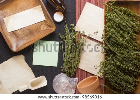 Directly above photograph of thyme, papers, and decorative objects to portray the topic of alternative medicine or culinary. Add your text to the papers.