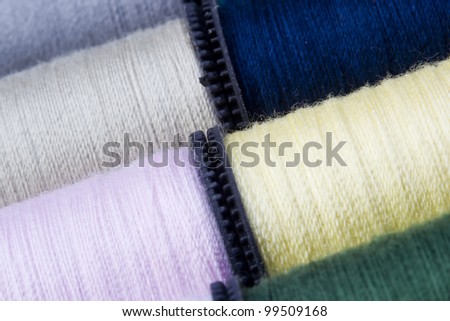 Full frame shot of a variety of spools of thread.