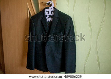 groom jacket hanging on a hanger