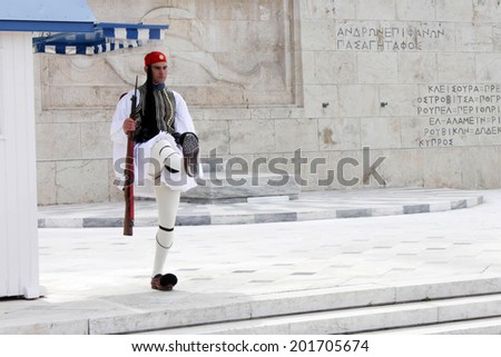 Athens, Greece - May 18 2014. The Greek Presidential guard called Tsoliades dressed in traditional uniform at the monument of the unknown soldier in front of parliament
