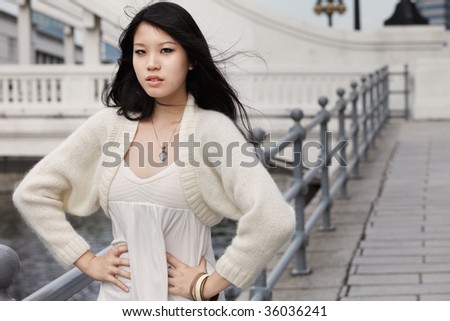 Beautiful, young Chinese Beauty with windswept hair.