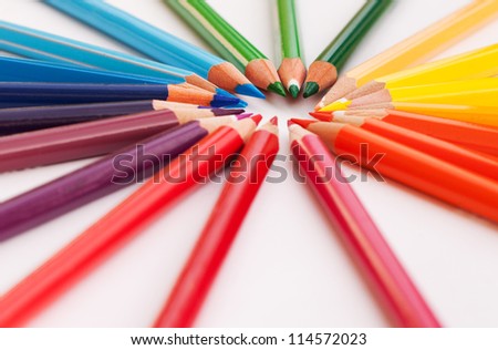 Color pencils in a circle with rainbow colors