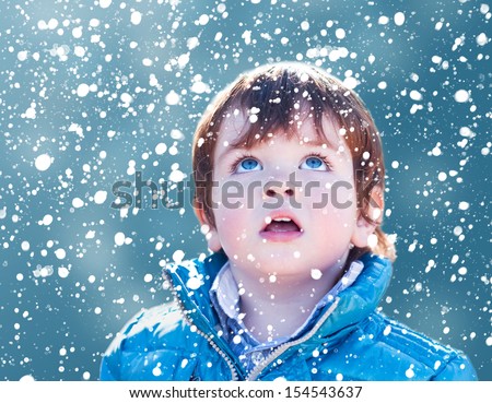 Child Looking Snow Falling With His Mouth Open