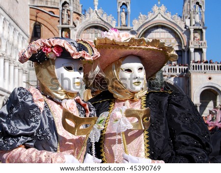 Couple wearing colorful carnival costumes in Venice, Italy
