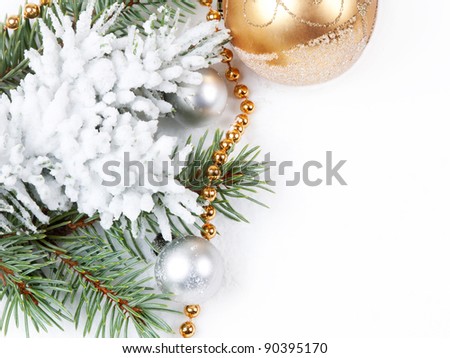 Christmas background with golden decorations   and fir branch