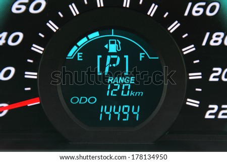 Close-up of a digital car fuel gauge