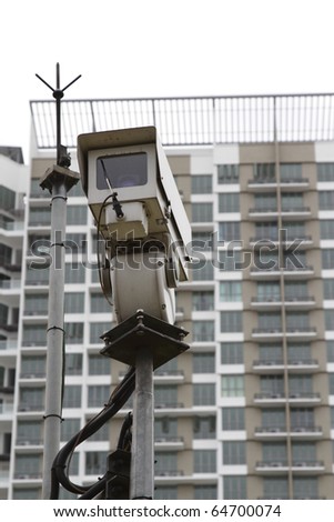 A security camera in front of an apartment building