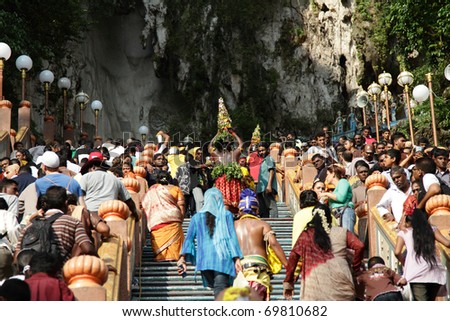 BATU CAVES, MALAYSIA - JANUARY 20: The crowd on the stairs leading up to a temple during the Hindu festival of Thaipusam on January 20, 2011 in Batu Caves, Malaysia.
